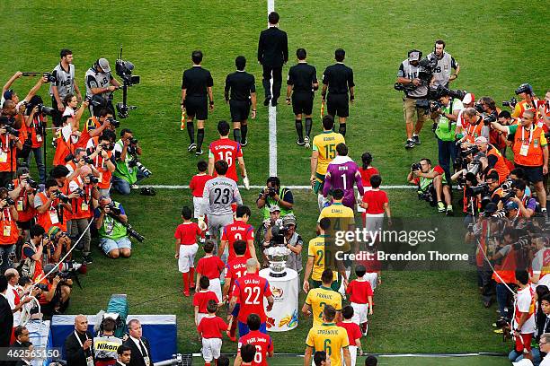 Players walk onto the field during the 2015 Asian Cup final match between Korea Republic and the Australian Socceroos at ANZ Stadium on January 31,...
