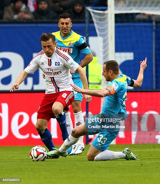 Ivica Olic of Hamburg and Matthias Lehmann of Koeln battle for the ball during the Bundesliga match between Hamburger SV and 1. FC Koeln at Imtech...