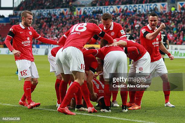 Yunus Malli celebrates his team's first goal with team mates during the Bundesliga match between 1. FSV Mainz 05 and SC Paderborn at Coface Arena on...