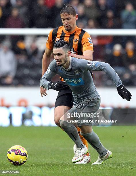 Hull City's Uruguayan forward Gaston Ramirez challenges Newcastle United's French midfielder Remy Cabella during the English Premier League football...