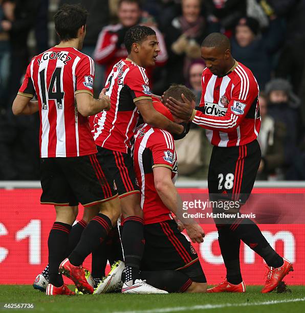 Connor Wickham of Sunderland celebrates with team mates after scoring the opening goal uring the Barclays Premier League match between Sunderland and...