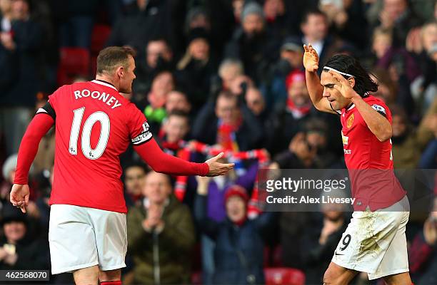Radamel Falcao García of Manchester United celebrates with teammate Wayne Rooney of Manchester United after scoring his team's second goal during the...