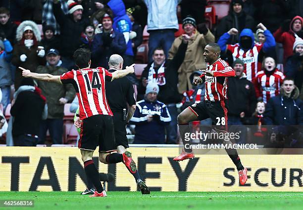 Jermain Defoe celebrates after scoring his team's second goal during the English Premier League football match between Sunderland and Burnley at The...