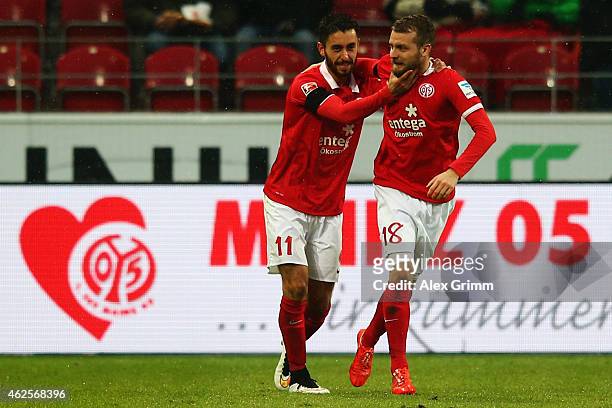 Yunus Malli of Mainz celebrates his team's second goal with team mate Daniel Brosinski during the Bundesliga match between 1. FSV Mainz 05 and SC...