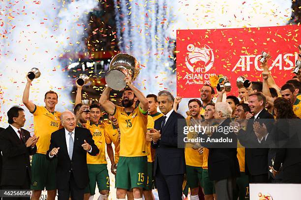 Australian captain Mile Jedinak lifts the trophy after the 2015 Asia Cup Final between Australia Vs South Korea in the 2015 AFC Asian Cup match at...