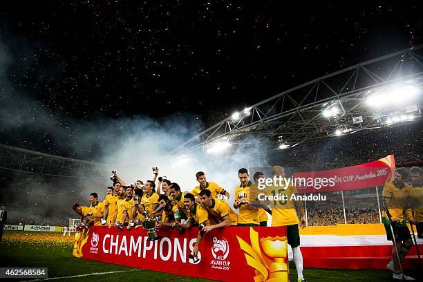 Australian team celebrate as captain Mile Jedinak lifts the trophy after the 2015 Asia Cup Final between Australia Vs South Korea in the 2015 AFC...