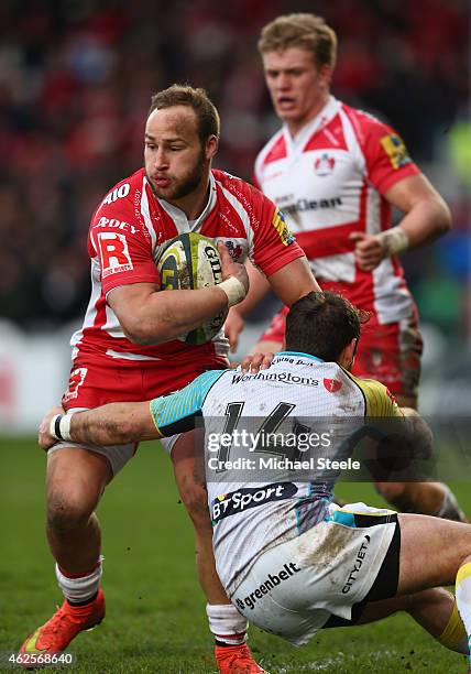 Bill Meakes of Gloucester sidesteps a challenge from Tom Grabham of Ospreys during the LV=Cup match between Gloucester Rugby and Ospreys at Kingsholm...