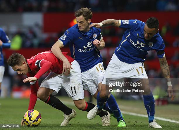 Adnan Januzaj of Manchester United in action with Andy King and Danny Simpson of Leicester City during the Barclays Premier League match between...