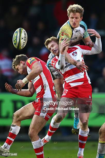 Ben John of Ospreys contests a high ball with Henry Purdy and Aled Thomas of Gloucester during the LV=Cup match between Gloucester Rugby and Ospreys...