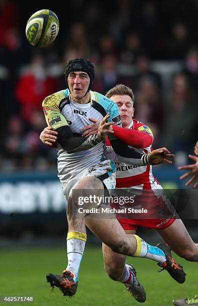 Sam Davies of Ospreys passes under pressure from Callum Braley of Gloucester during the LV=Cup match between Gloucester Rugby and Ospreys at...