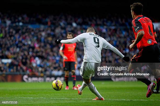 Karim Benzema of Real Madrid CF scores their fourth goal during the La Liga match between Real Madrid CF and Real Sociedad de Futbol at Estadio...