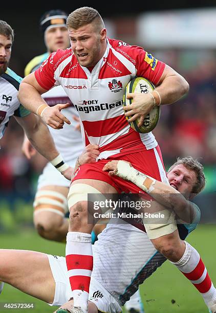 Ross Moriarty of Gloucester is held up by Ben John of Ospreys during the LV=Cup match between Gloucester Rugby and Ospreys at Kingsholm Stadium on...