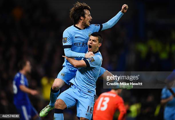 Goalscorer David Silva of Manchester City celebrates with teammate Sergio Aguero after scoring the equalising goal during the Barclays Premier League...