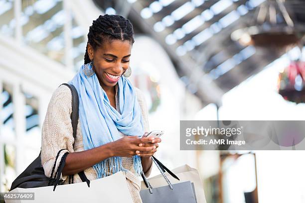 beautiful girl shopping - african ethnicity luxury stock pictures, royalty-free photos & images