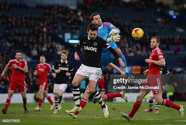 Ryan Dow of Dundee United battles with Scott Brown of Aberdeen during the Scottish League Cup Semi-Final match between Dundee United and Aberdeen at...