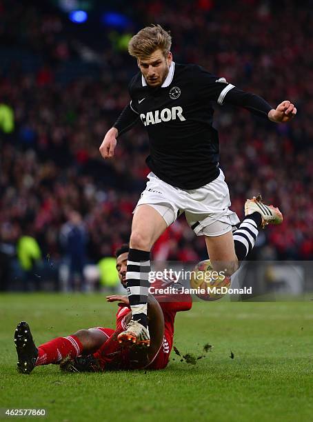 Stuart Armstrong of Dundee United battles with Shay Logan of Aberdeen during the Scottish League Cup Semi-Final match between Dundee United and...