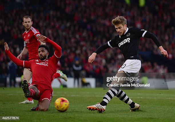 Stuart Armstrong of Dundee United battles with Shay Logan of Aberdeen during the Scottish League Cup Semi-Final match between Dundee United and...