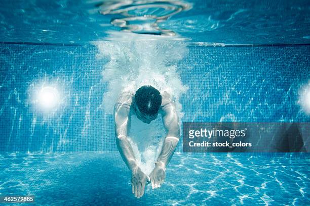 swimmer - man underwater stock pictures, royalty-free photos & images
