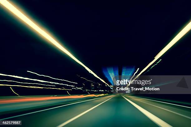 dark highway at night, with streaks of light - front view bildbanksfoton och bilder