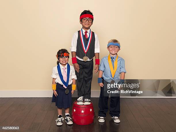 young children wearing medals from office competition - olympic podium stock pictures, royalty-free photos & images