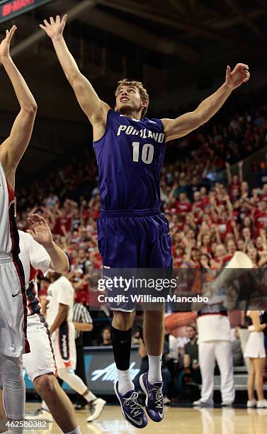 Jason Todd of the Portland Pilots reaches for a rebound against the Gonzaga Bulldogs in the game at McCarthey Athletic Center on January 29, 2015 in...