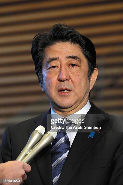 Japanese Prime Minister Shinzo Abe speaks to media reporters at his official residence on February 1, 2015 in Tokyo, Japan. The video purported to...