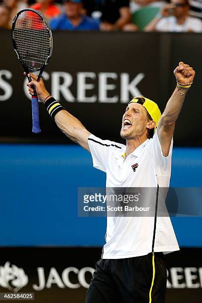 Andreas Seppi of Italy celebrates winning in his first round match against Lleyton Hewitt of Australia during day two of the 2014 Australian Open at...