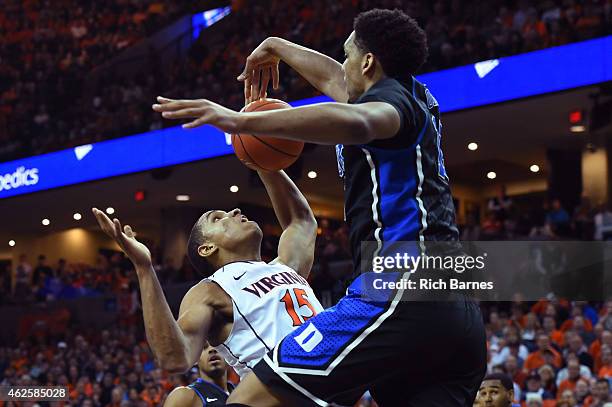 Jahlil Okafor of the Duke Blue Devils blocks the shot of Malcolm Brogdon of the Virginia Cavaliers during the first half at John Paul Jones Arena on...