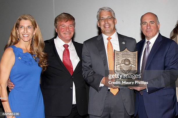 Stephanie Hickey, host Leigh Steinberg, Miami Dolphins General Manager Dennis Hickey with the Executive's Award, and entrepreneur Cosmo DeNicola...