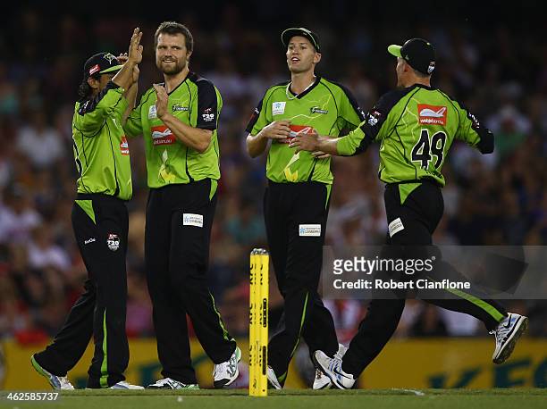Dirk Nannes of the Thunder celebrates taking the wicket of Aaron OBrien of the Renegades during the Big Bash League match between the Melbourne...