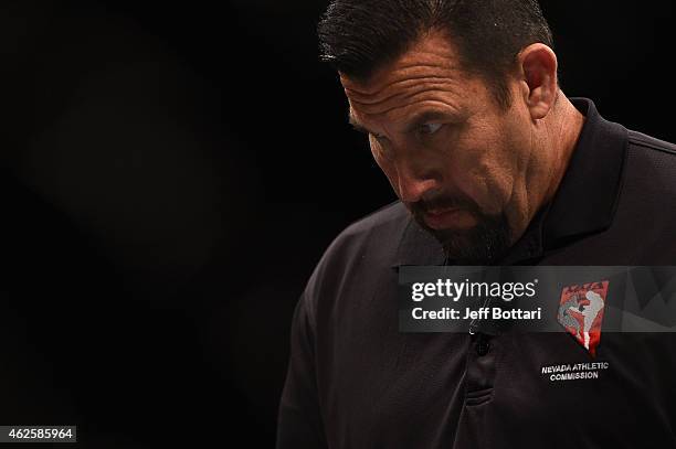 Referee John McCarthy observes Ian McCall vs John Lineker in their flyweight bout during the UFC 183 event at the MGM Grand Garden Arena on January...