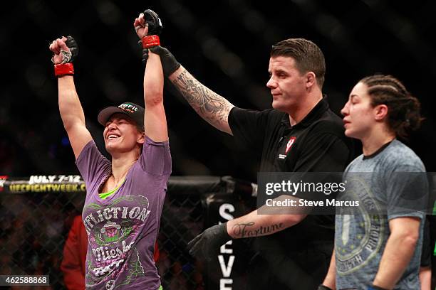 Miesha Tate is declared the winner over Sara McMann in their bantamweight bout during UFC 183 at the MGM Grand Garden Arena on January 31, 2015 in...
