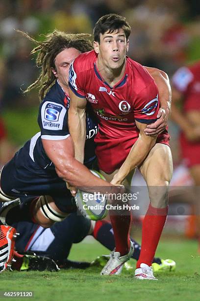 Scott Gale of the Reds passes during the Super Rugby trial match between the Queensland Reds and the Melbourne Rebels at Barlow Park on January 31,...