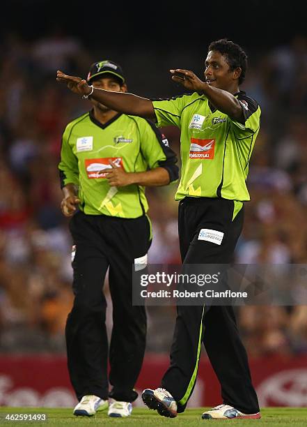 Ajantha Mendis of the Thunder celebrates the wicket of James Pattinson of the Renegades during the Big Bash League match between the Melbourne...