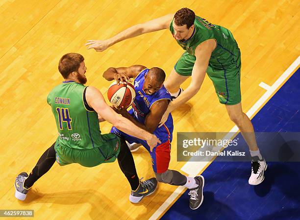 Jamar Wilson of the Adelaide 36ers competes for the ball with Brian Conklin of the Townsville Crocs during the round 17 NBL match between the...