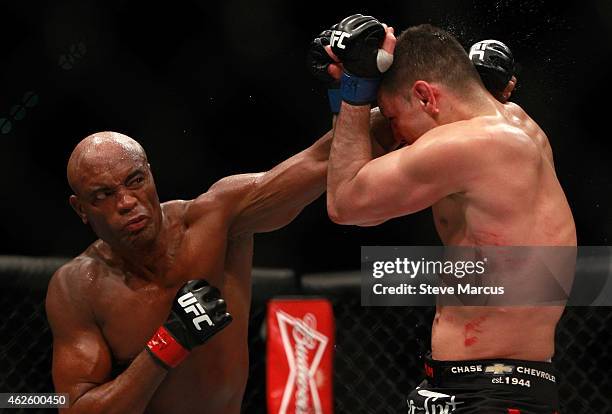 Anderson Silva punches at Nick Diaz in their middleweight bout during UFC 183 at the MGM Grand Garden Arena on January 31, 2015 in Las Vegas, Nevada....