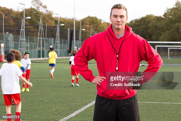 soccer coach on the pitch - coach stock pictures, royalty-free photos & images