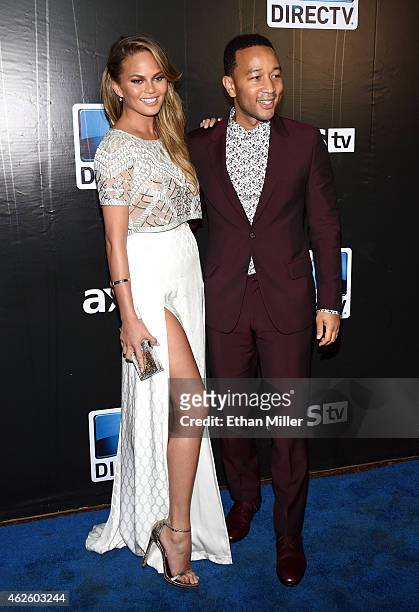 Model Chrissy Teigen and recording artist John Legend attend DirecTV Super Saturday Night hosted by Mark Cuban's AXS TV and Pro Football Hall of...