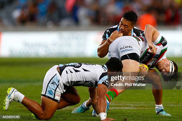 Angus Crichton of the Rabbitohs is tackled during the grand final match between the South Sydney Rabbitohs and the Cronulla-Sutherland Sharks in the...