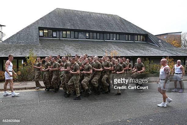 Recruits undergo physical training at the Commando Training Centre Royal Marines on November 18, 2014 in Lympstone, United Kingdom. Recruit training...