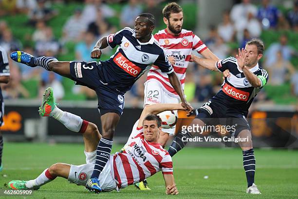 Adama Traore, Tomi Juric, Dean Heffernan and Leigh Broxham contest for the ball during the round 19 A-League match between Melbourne Victory and the...