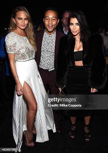 Model Chrissy Teigen, recording artist John Legend and TV personality Kim Kardashian attend DirecTV Super Saturday Night hosted by Mark Cuban's AXS...