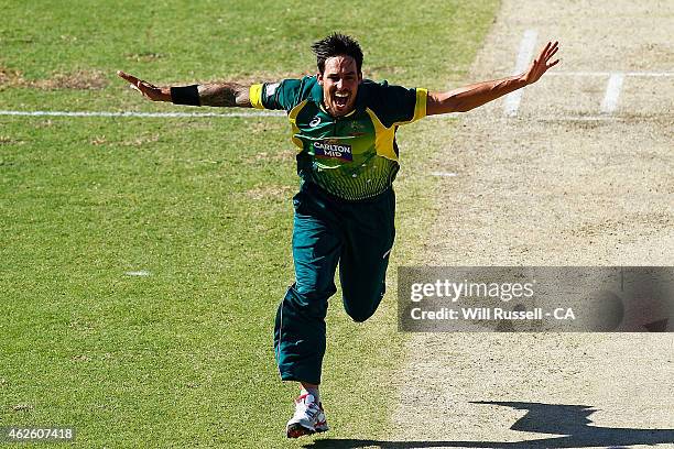 Mitchell Johnson of Australia celebrates after taking the wicket of James Taylor of England during the final match of the Carlton Mid One Day...