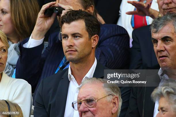 Australian golfer Adam Scott watches the action at Rod Laver Arena during day 14 of the 2015 Australian Open at Melbourne Park on February 1, 2015 in...