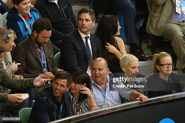 Actress Toni Collette and Actor Eric Bana watch the action at Rod Laver Arena during day 14 of the 2015 Australian Open at Melbourne Park on February...