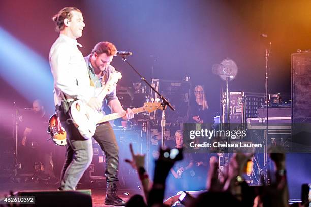 Singer Gwen Stefani and her children look on as musician Gavin Rossdale of Bush performs at The Wiltern on January 31, 2015 in Los Angeles,...