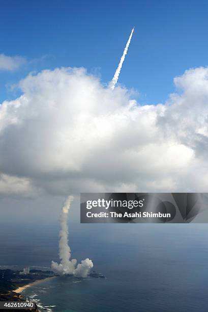 In this aerial image, the H-2A Launch Vehicle No. 27 of the Japan Aerospace Exploration Agency lifts off from the Tanegashima Space Center on...