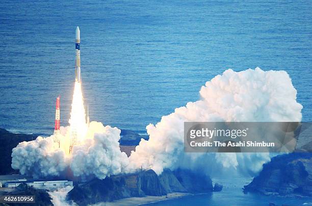 In this aerial image, the H-2A Launch Vehicle No. 27 of the Japan Aerospace Exploration Agency lifts off from the Tanegashima Space Center on...