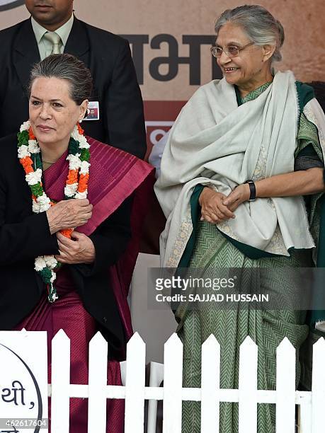 India's Congress party President Sonia Gandhi and former Delhi chief minister Sheila Dikshit attend an election campaign rally ahead of the Delhi...