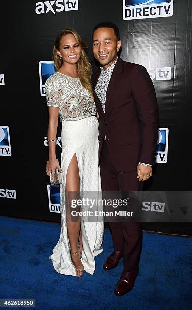 Model Chrissy Teigen and recording artist John Legend attend DirecTV Super Saturday Night hosted by Mark Cuban's AXS TV and Pro Football Hall of...